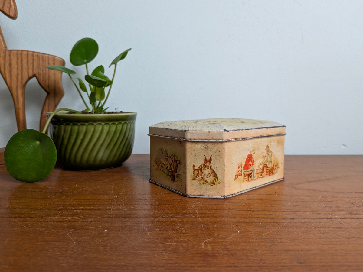 Oud blikken doosje met sprookjesillustraties