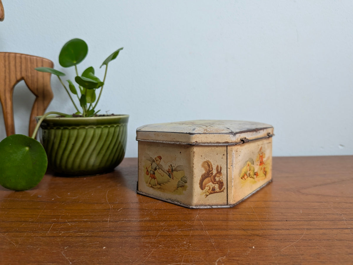Oud blikken doosje met sprookjesillustraties